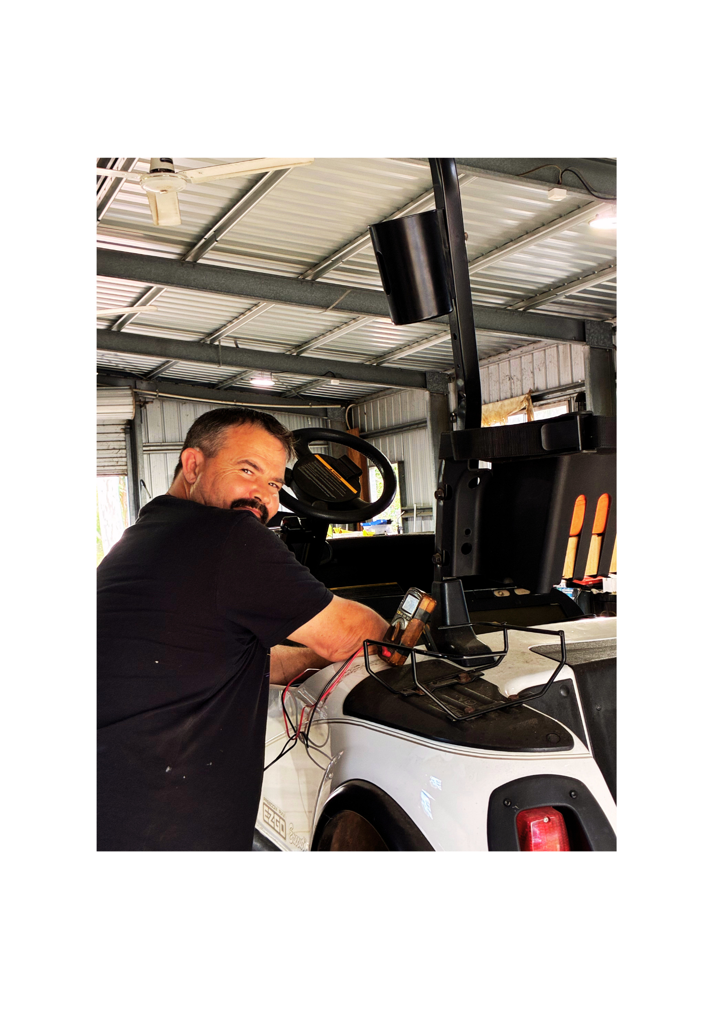 Al working on a golf buggy